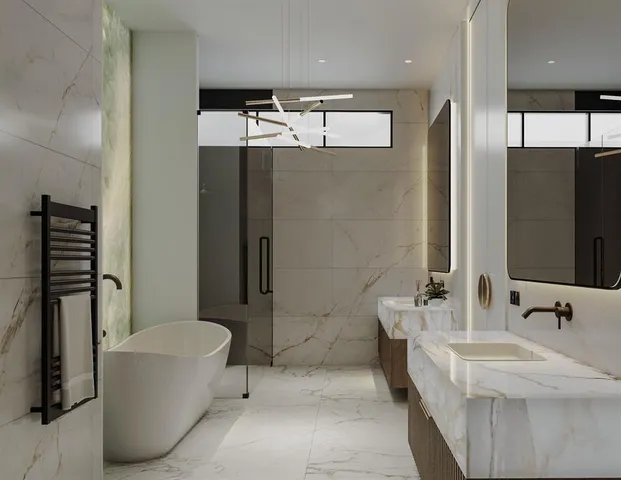 a bathroom with a tub sink and mirror