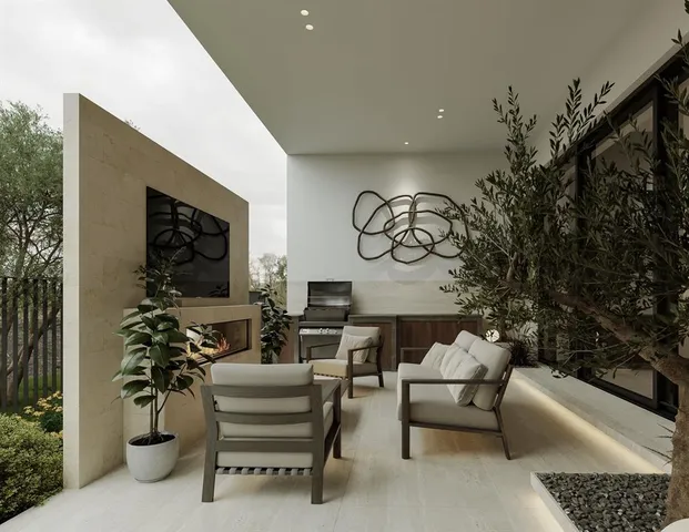 a living room with furniture and a potted plant