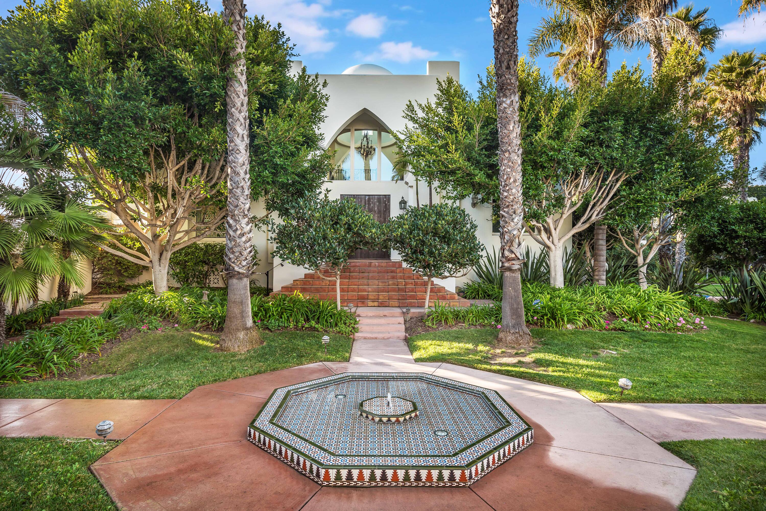 a swimming pool with outdoor seating and yard