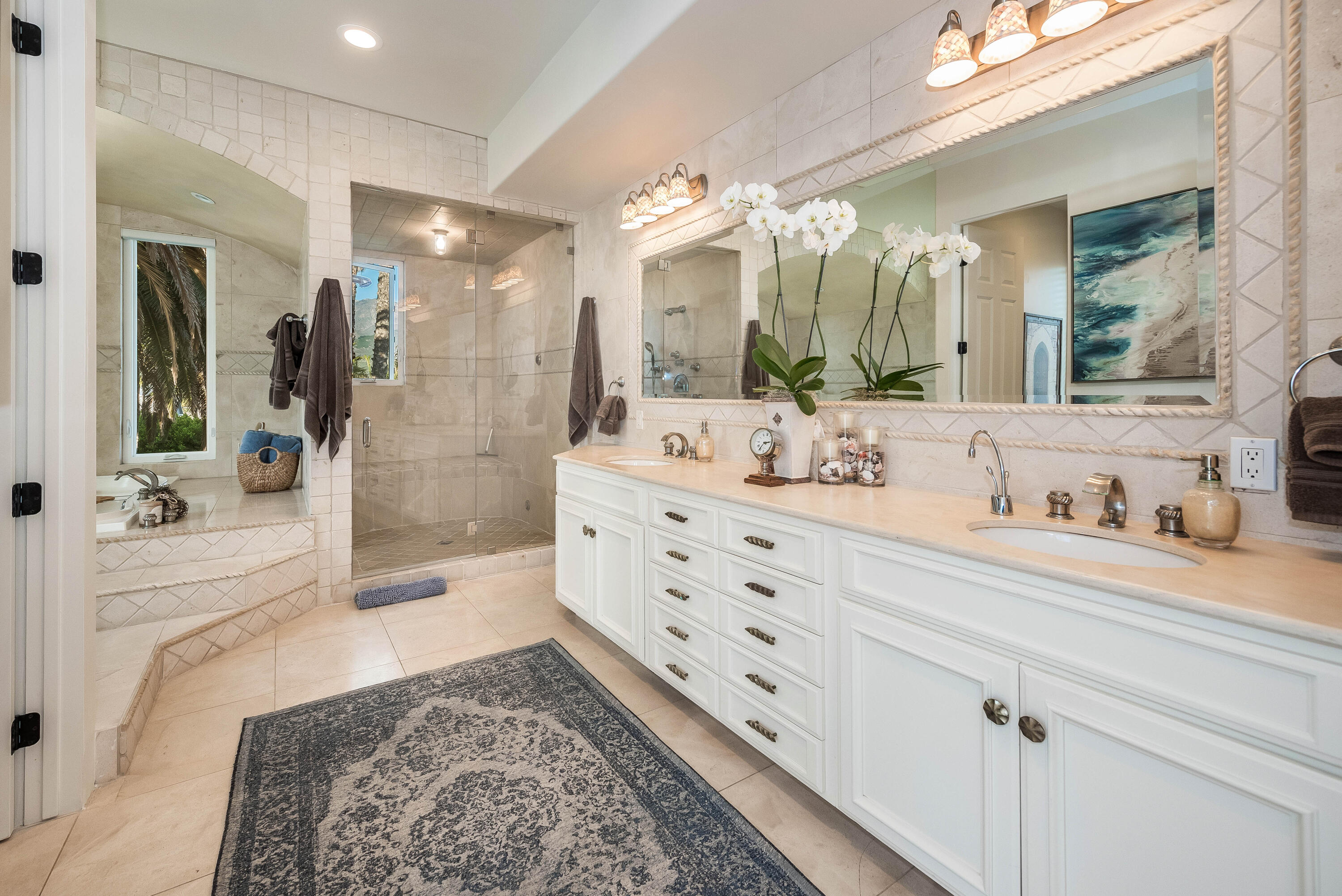 875 Sand Point Road Carpinteria, CA 93013 - Photo 13 of 25 a bathroom with a double vanity sink mirror and shower