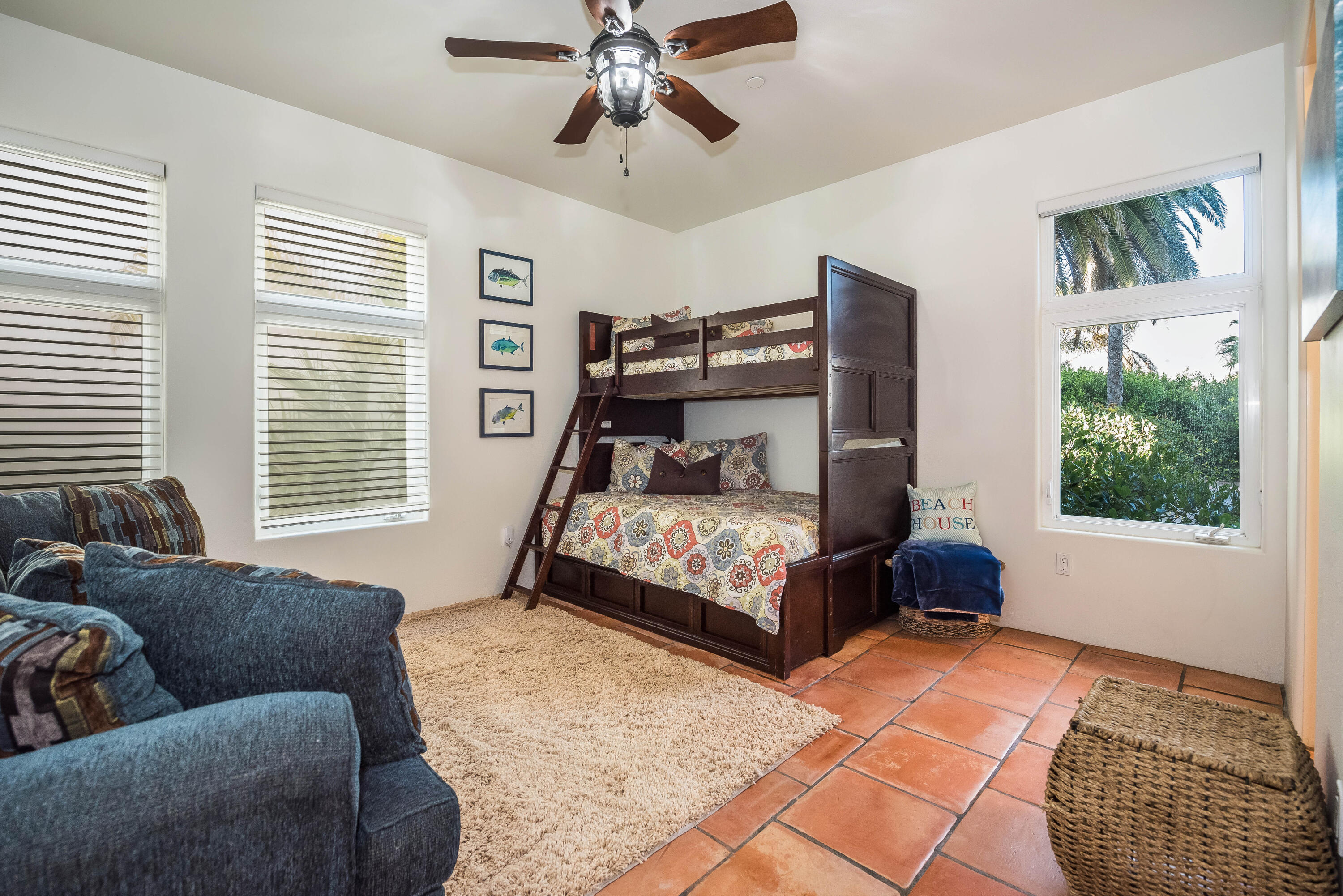 875 Sand Point Road Carpinteria, CA 93013 - Photo 17 of 25 a bedroom with a bed couch and window