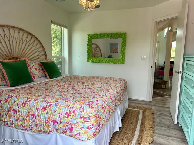 a bedroom with bed and a window