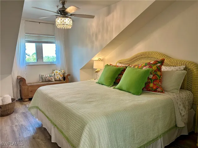 a bedroom with a bed and a television