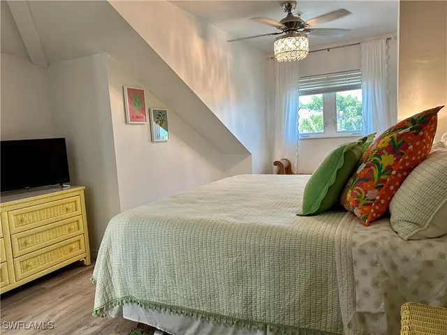 a bathroom with a granite countertop toilet a sink and a mirror
