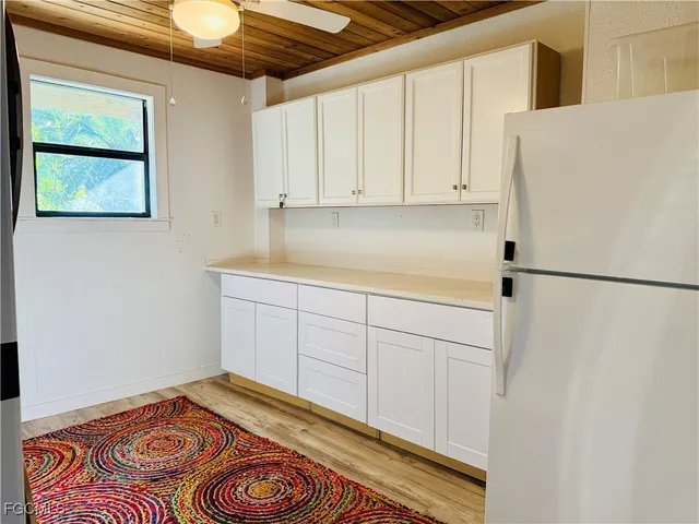 a view of a kitchen with a washer and dryer