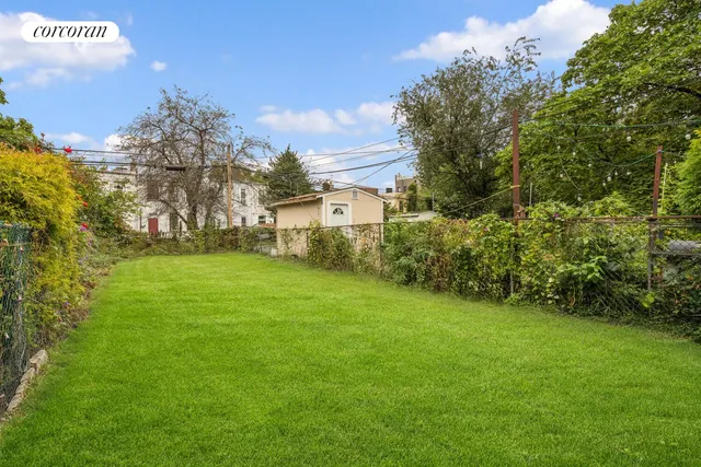 a view of a backyard with a garden