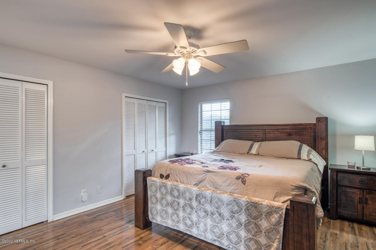 332 Shamrock Road St. Augustine, FL 32086 - Photo 14 of 26 a bedroom with a bed and window