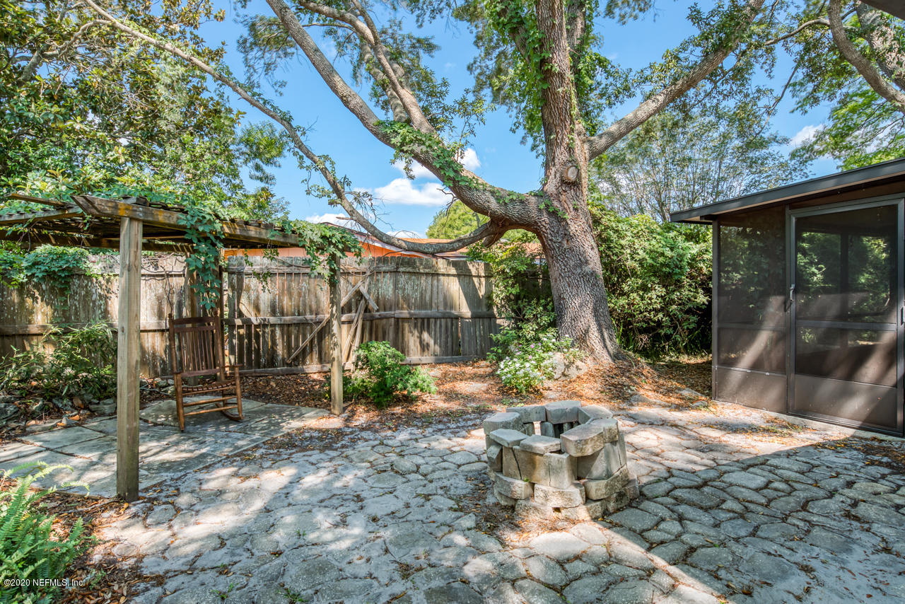 332 Shamrock Road St. Augustine, FL 32086 - Photo 24 of 26 a view of a chair and table in backyard
