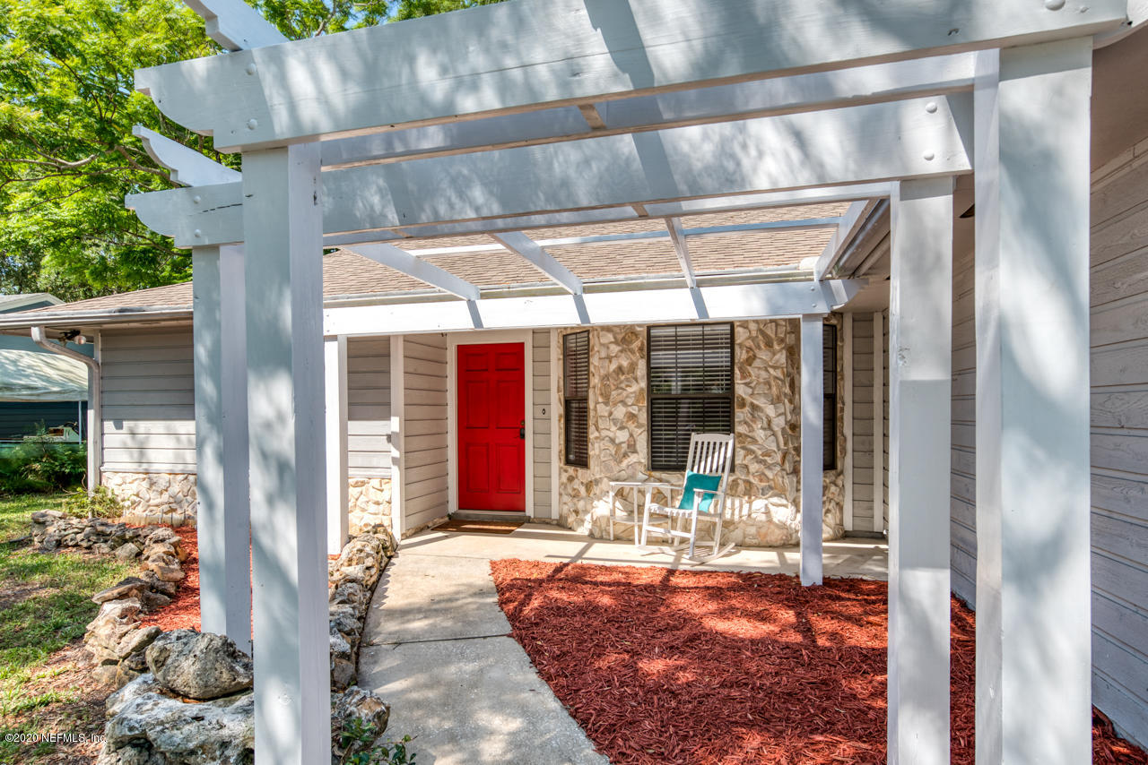 332 Shamrock Road St. Augustine, FL 32086 - Photo 4 of 26 a outdoor view of a building with sitting area