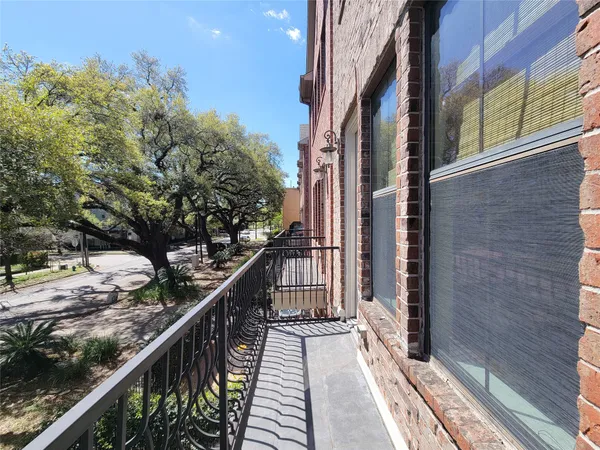 a view of a balcony with wooden floor and stairs