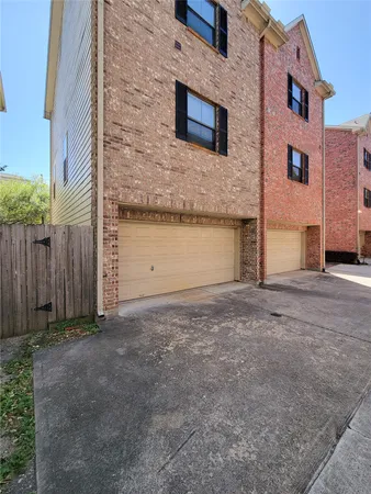 a view of a brick building with an outdoor space