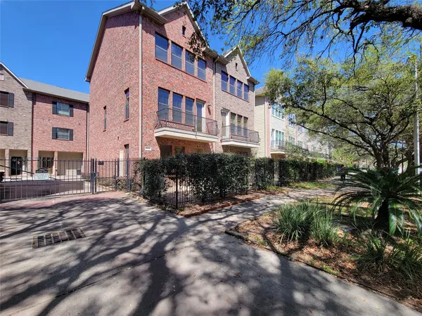 a view of a building with a yard