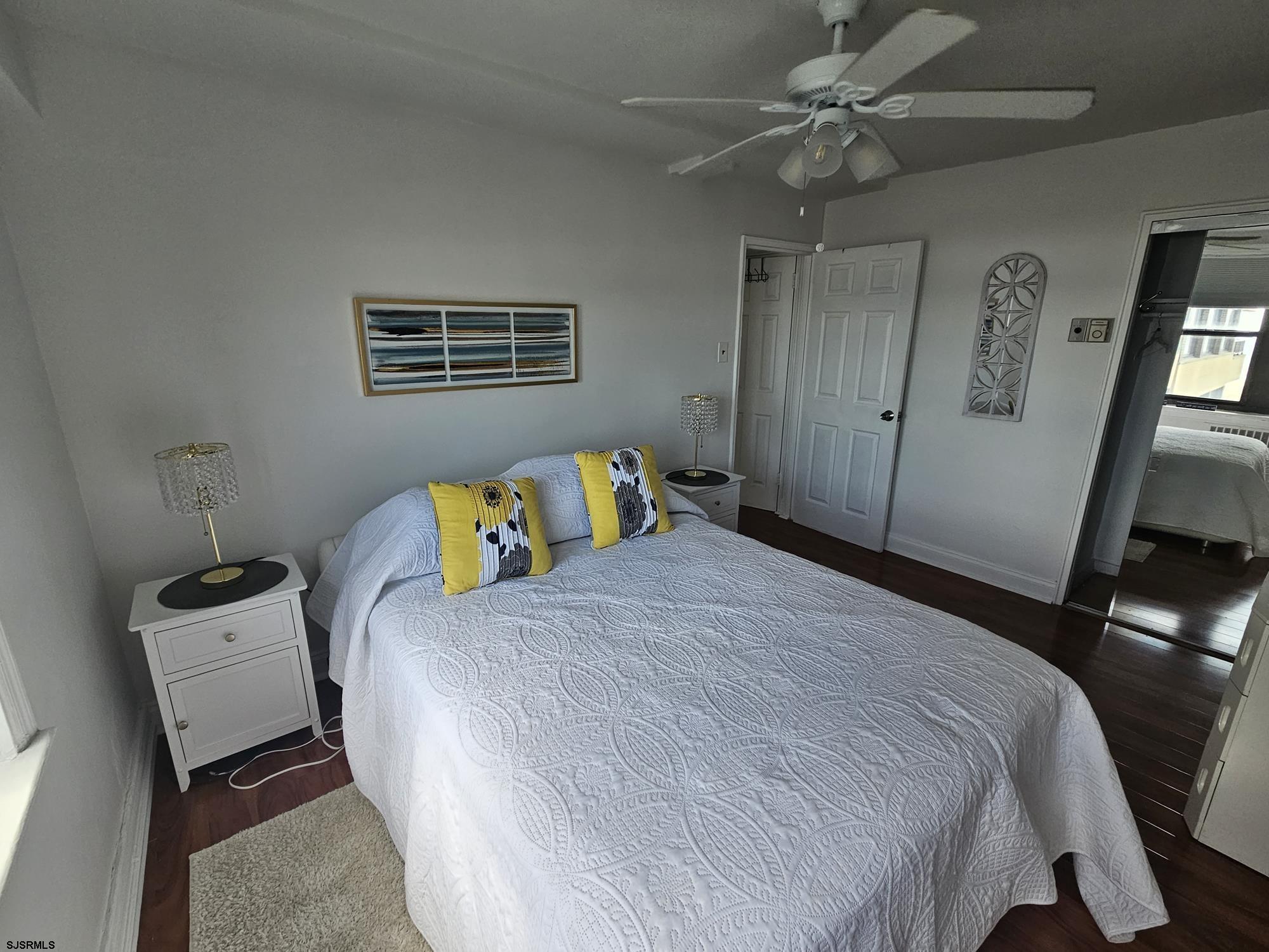 101 South Raleigh Avenue, Unit 734 Atlantic City, NJ 08401 - Photo 17 of 32 a bedroom with a bed and wooden floor