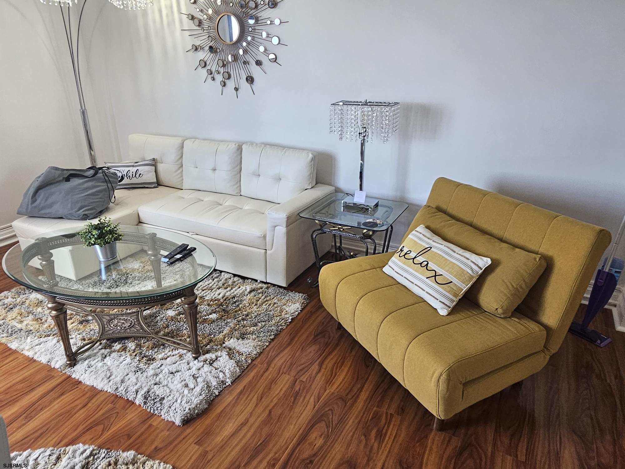 101 South Raleigh Avenue, Unit 734 Atlantic City, NJ 08401 - Photo 6 of 32 a living room with furniture and a table