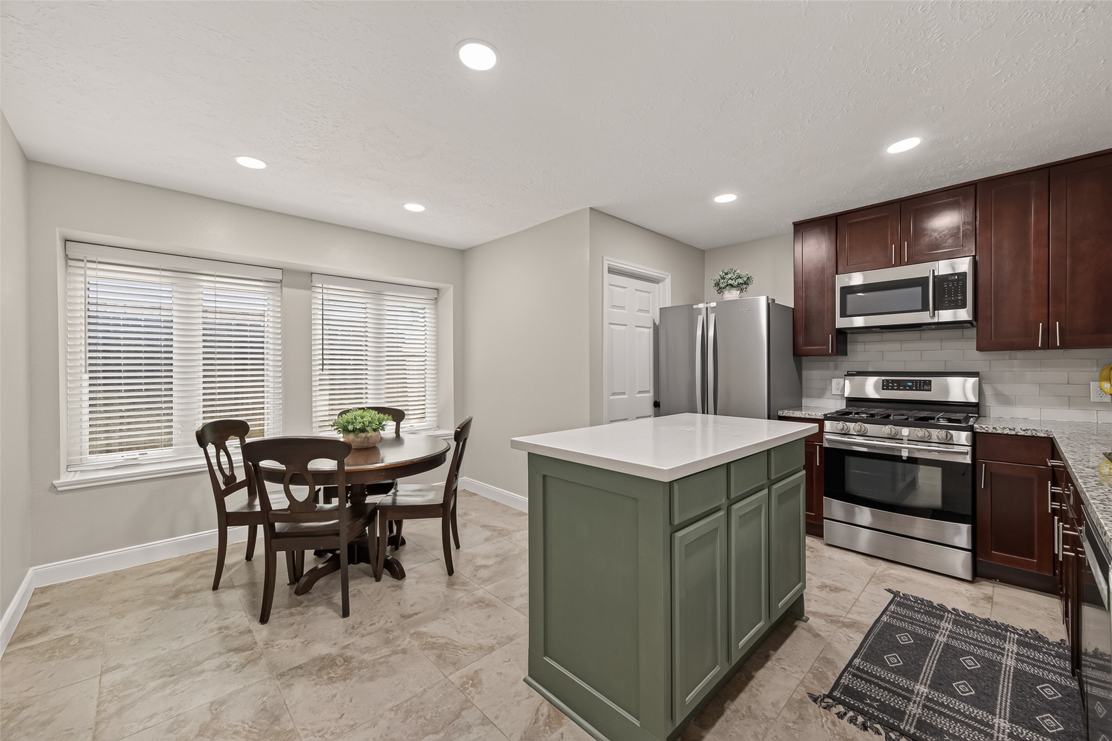 22939 Indian Ridge Drive Katy, TX 77450 - Photo 11 of 35 Kitchen with stainless steel appliances and eat-in breakfast room