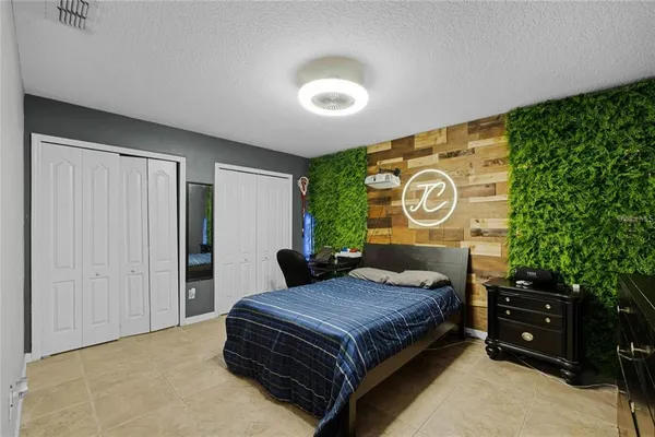 a bedroom with a bed and a closet