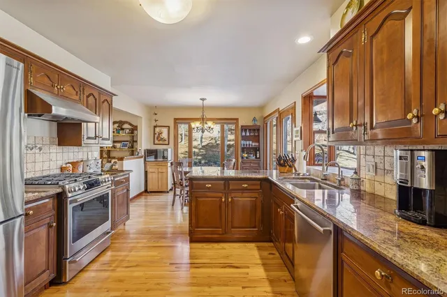 a bathroom with a sink vanity mirror and toilet