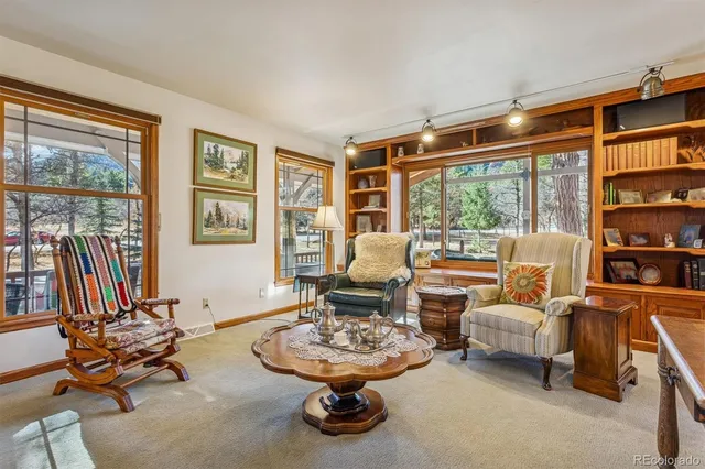 a view of a dining room with furniture window and outside view