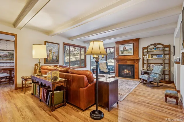 a kitchen with lots of counter top space and painting on the wall