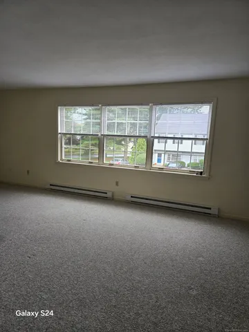an empty room with a fireplace