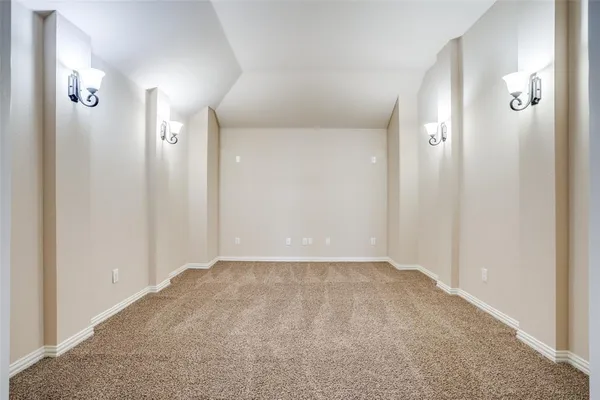 an empty room with a mirror