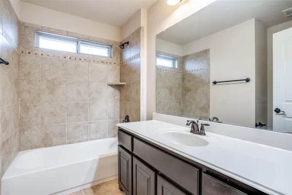 a bathroom with a sink and a bathtub