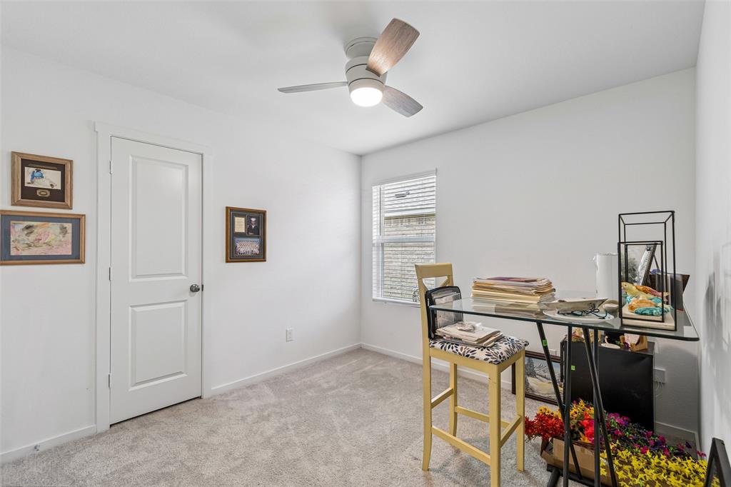 14163 Kempt Drive Pilot Point, TX 76258 - Photo 18 of 29 Flexible secondary bedroom with a ceiling fan, natural light, and endless possibilities as a guest room, home office, or hobby space.