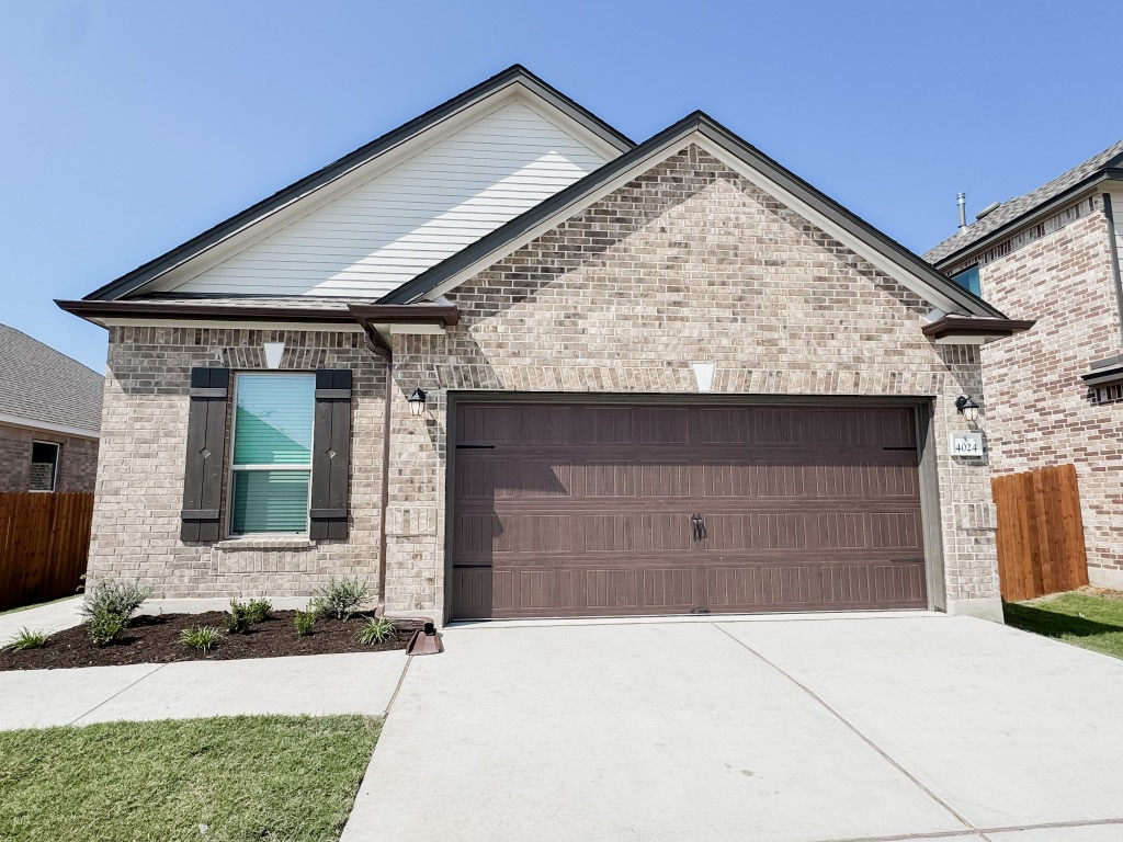 4024 Pinto Lane Round Rock, TX 78665 - Photo 1 of 31 a front view of a house with garage