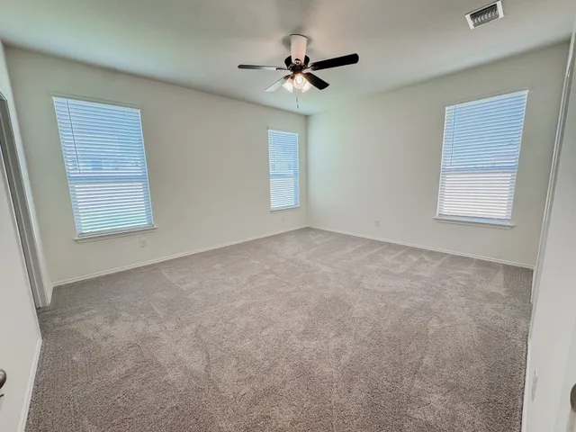 an empty room with closet area