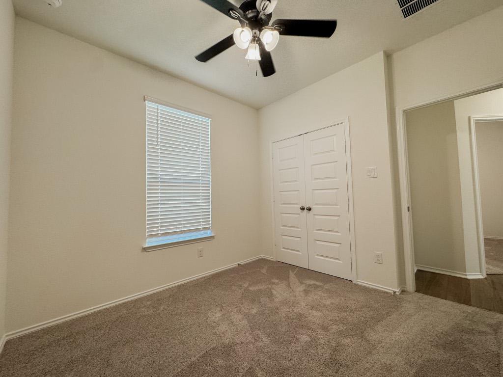 4024 Pinto Lane Round Rock, TX 78665 - Photo 20 of 31 an empty room with closet and windows