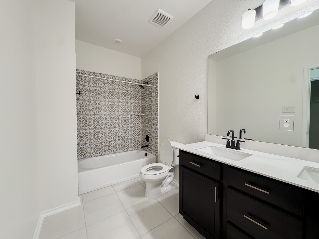 4024 Pinto Lane Round Rock, TX 78665 - Photo 23 of 31 a bathroom with a sink a toilet and shower