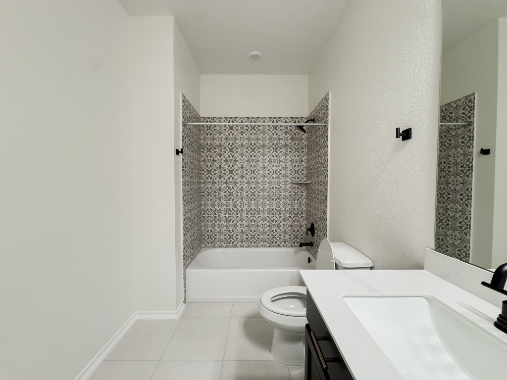 4024 Pinto Lane Round Rock, TX 78665 - Photo 24 of 31 a bathroom with a sink a toilet and shower