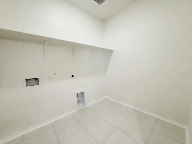 a view of a room with a ceiling fan