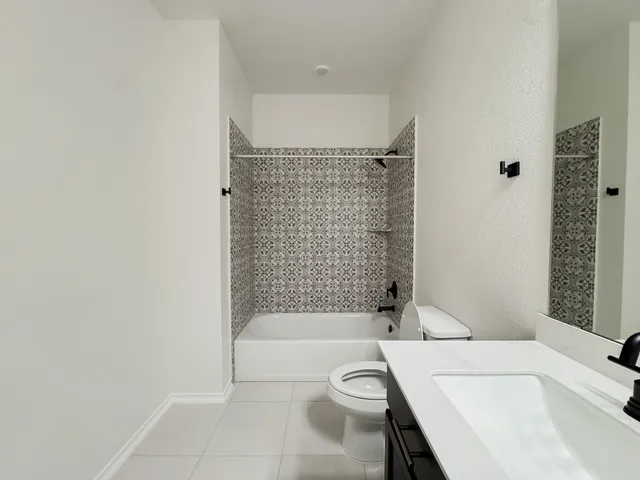 a view of a room with a ceiling fan