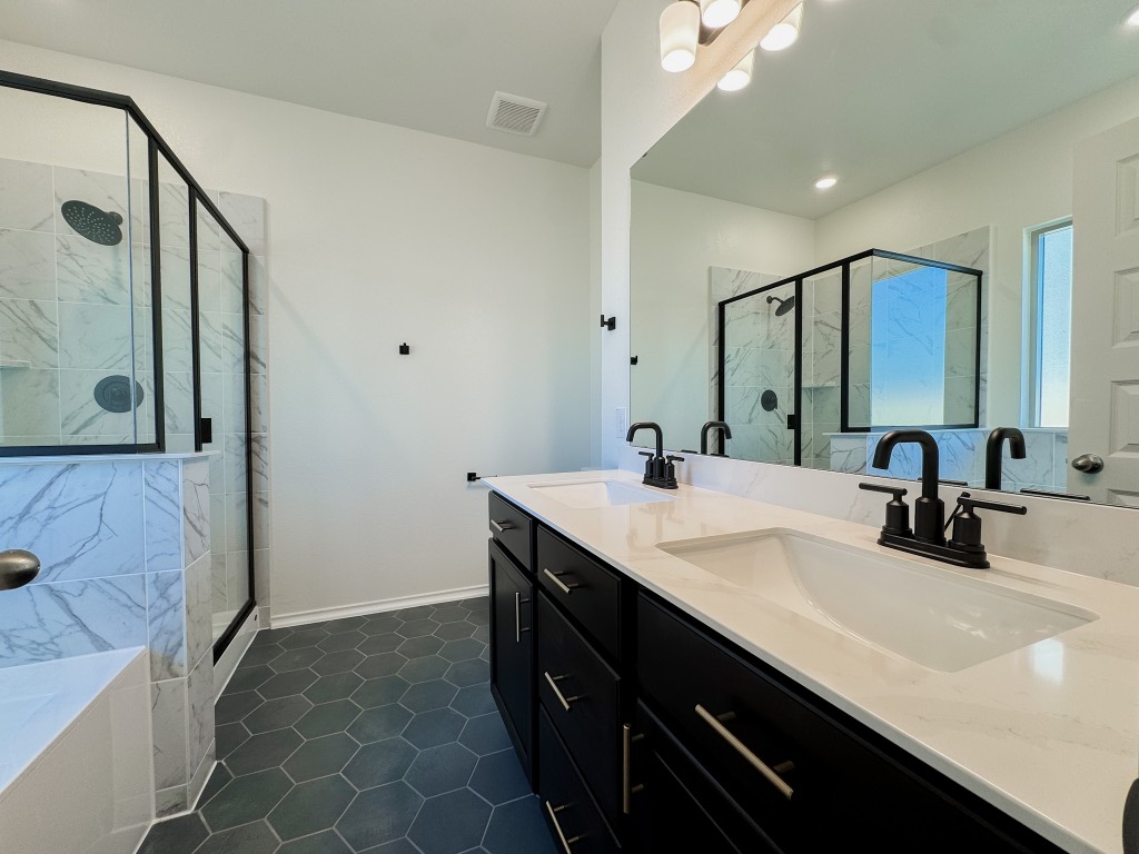 4024 Pinto Lane Round Rock, TX 78665 - Photo 5 of 31 a bathroom with a double vanity sink mirror and