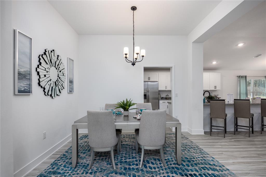 16929 Northwest 176th Way Alachua, FL 32615 - Photo 3 of 35 a view of a dining room with furniture