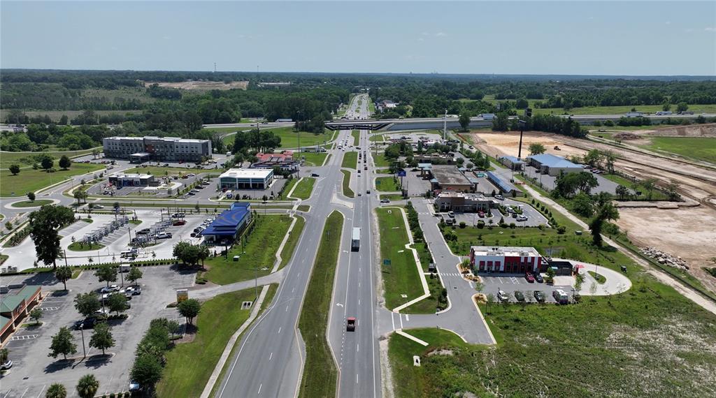 16929 Northwest 176th Way Alachua, FL 32615 - Photo 32 of 35 an aerial view of a house with a garden and lake view