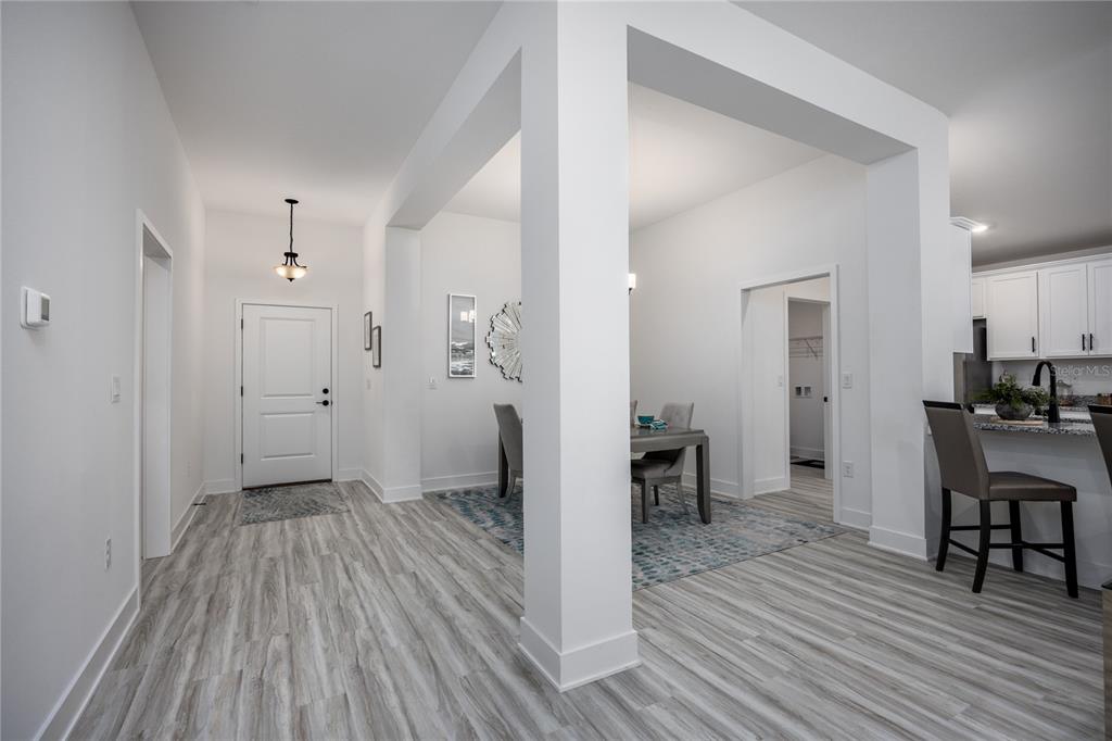 16929 Northwest 176th Way Alachua, FL 32615 - Photo 6 of 35 a view of a livingroom with furniture and wooden floor