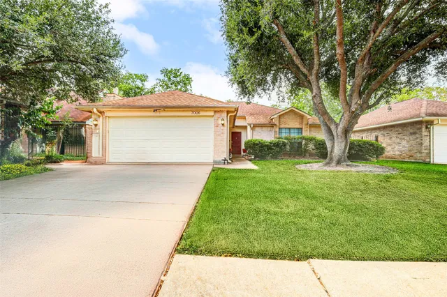a house view with a garden space