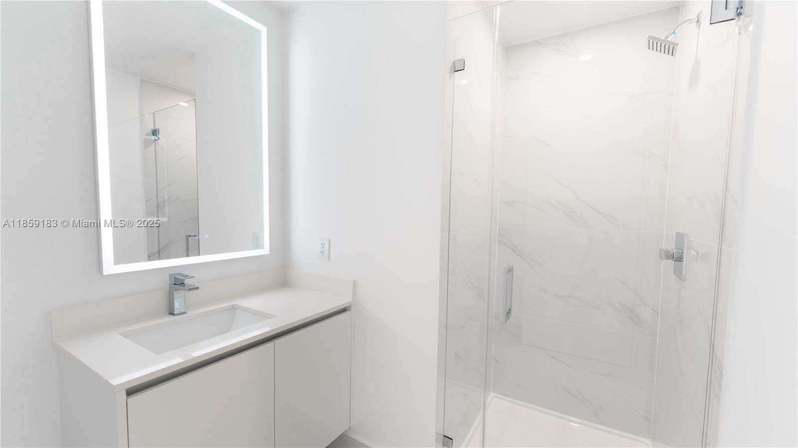 700 Northeast 24th Street, Unit 2905 Miami, FL 33137 - Photo 23 of 36 a bathroom with a sink and a mirror