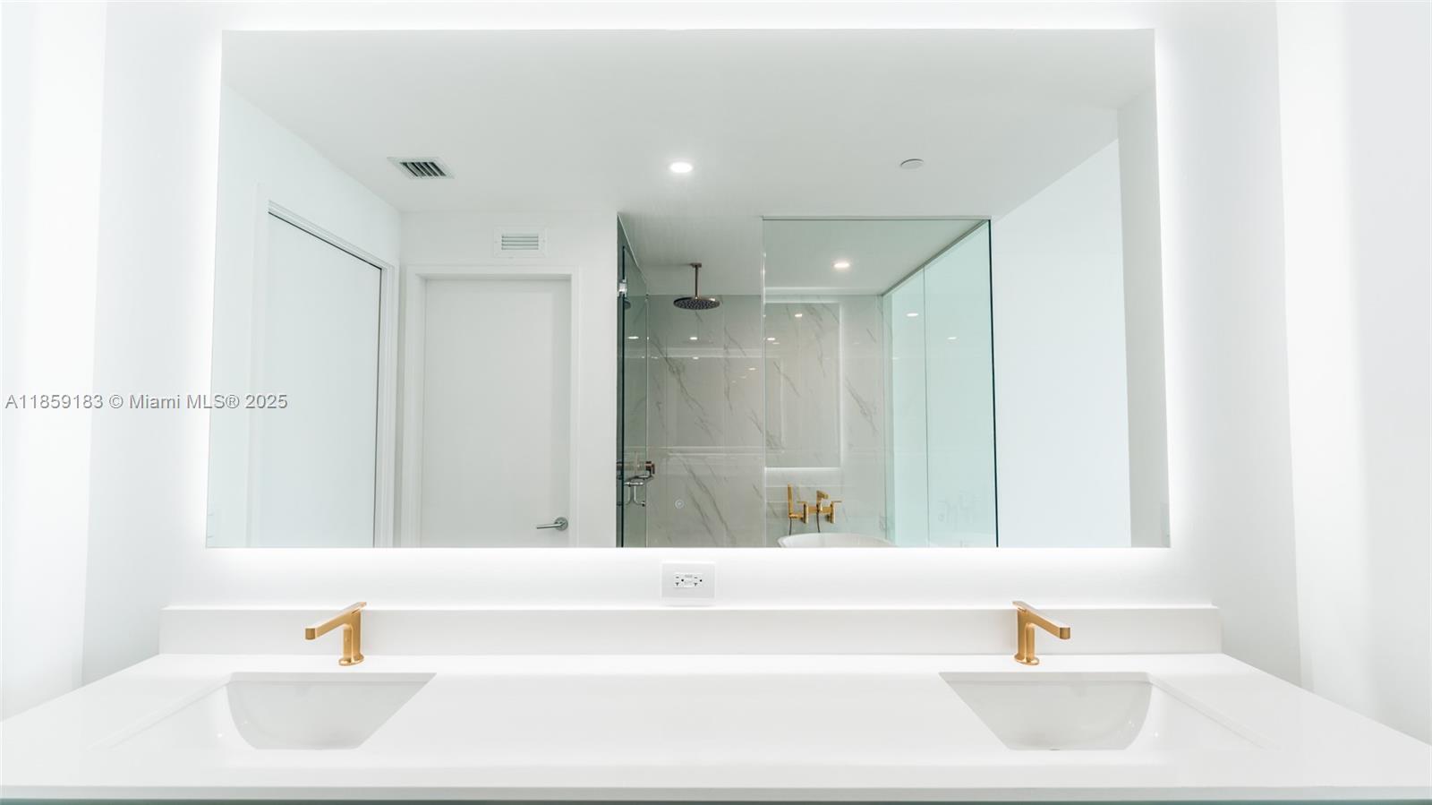 700 Northeast 24th Street, Unit 2905 Miami, FL 33137 - Photo 30 of 36 a bathroom with a bathtub and a sink