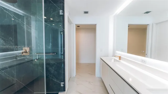 a view of a hallway with bathroom