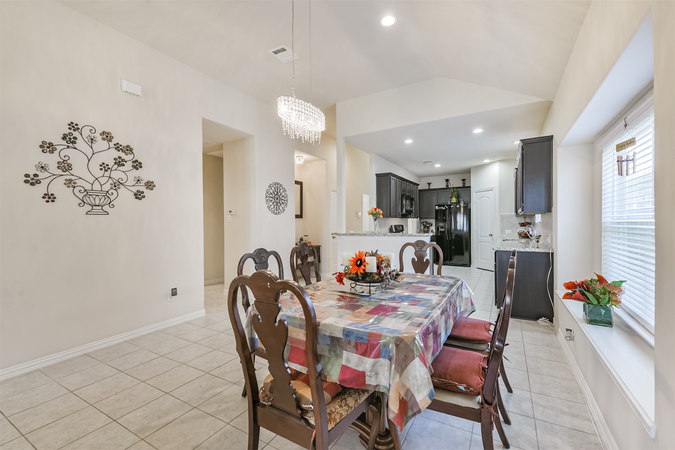 7527 Windsor Valley Lane Houston, TX 77049 - Photo 16 of 35 a dining room with furniture and natural light