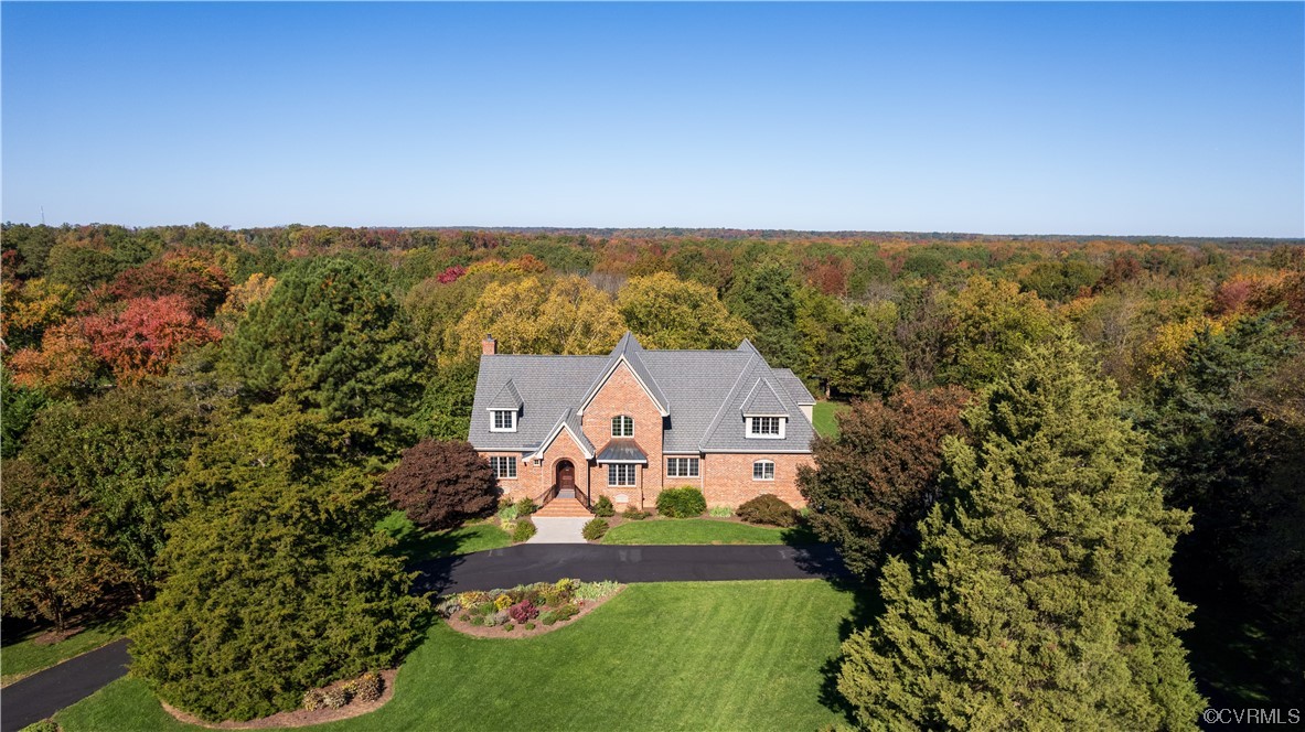 an aerial view of a house with a garden