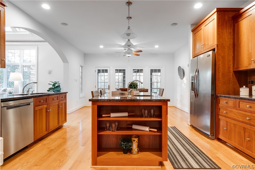 12110 Iron Forge Drive Midlothian, VA 23113 - Photo 13 of 50 a kitchen with stainless steel appliances granite countertop a refrigerator a sink dishwasher a stove and white countertops with wooden floor