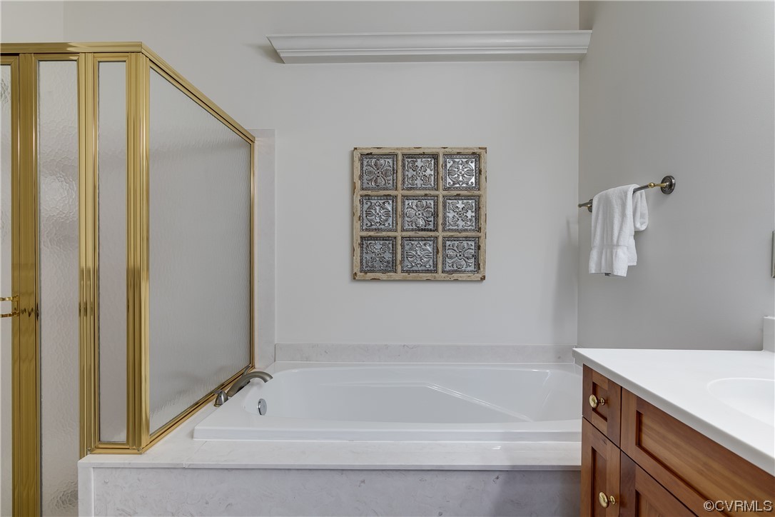 12110 Iron Forge Drive Midlothian, VA 23113 - Photo 23 of 50 a bathroom with a bathtub and a shower
