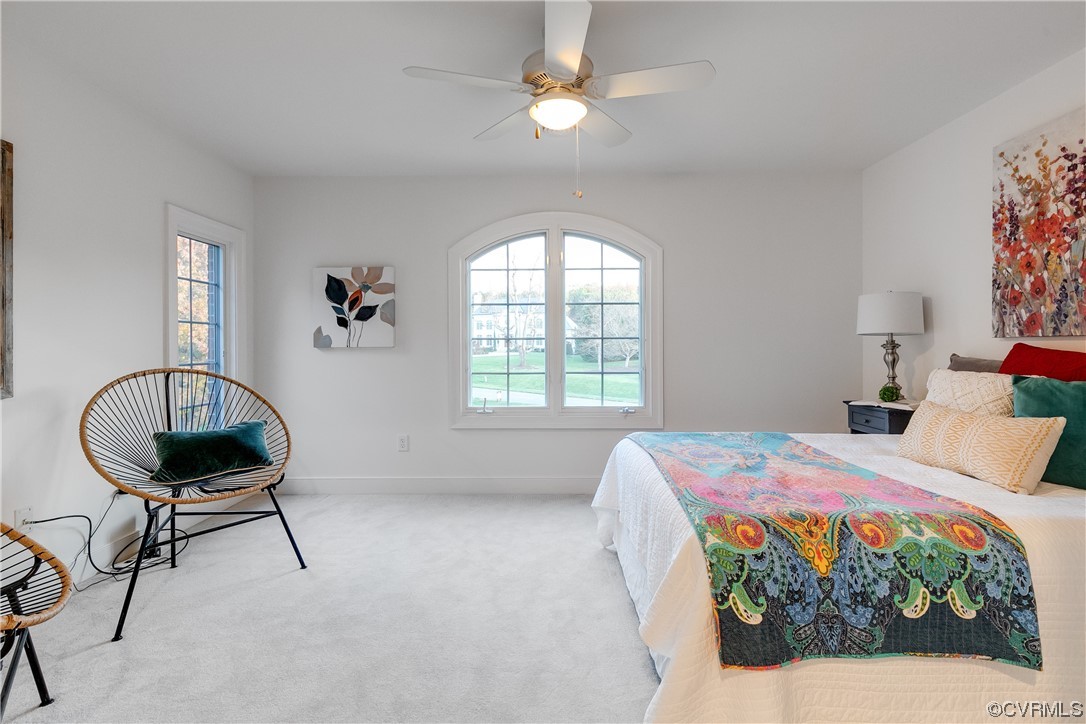 12110 Iron Forge Drive Midlothian, VA 23113 - Photo 34 of 50 a bedroom with a bed and a chandelier
