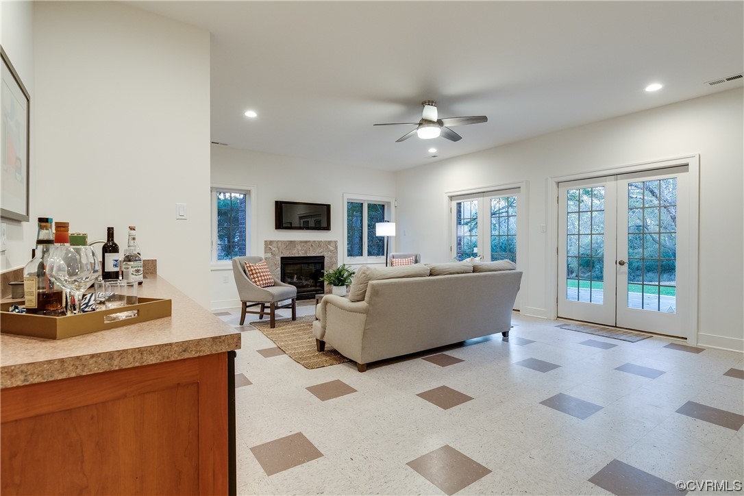 12110 Iron Forge Drive Midlothian, VA 23113 - Photo 36 of 50 a living room with furniture a fireplace and a flat screen tv
