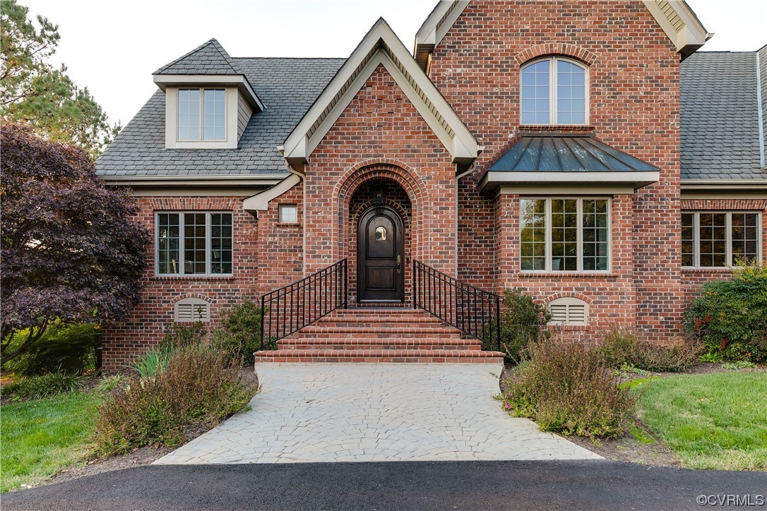 12110 Iron Forge Drive Midlothian, VA 23113 - Photo 4 of 50 a front view of a house with a garden