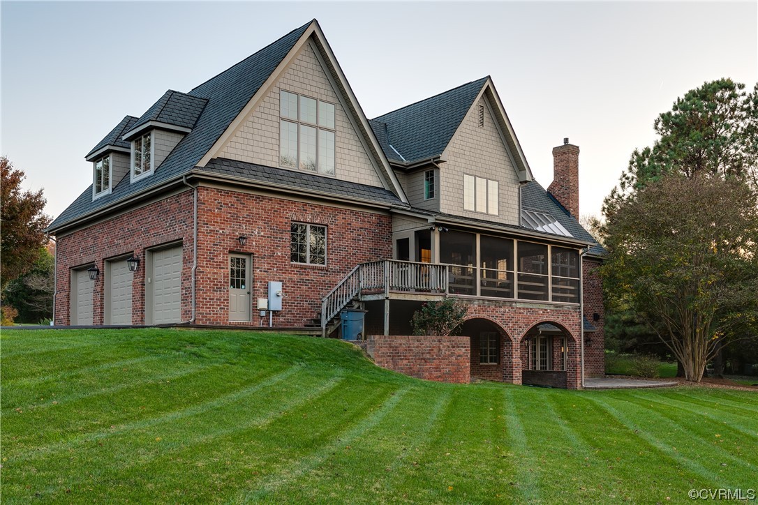 12110 Iron Forge Drive Midlothian, VA 23113 - Photo 43 of 50 a front view of a house with a yard and garage